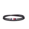 Close-up of a masculine wrist wearing the Tommy Hilfiger Black Leather Double Wrap Bracelet with stainless steel clasp, available in Bahrain.