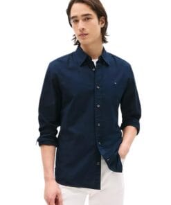 Model wearing Tommy Hilfiger Navy Stretch Oxford Shirt, ideal for business casual style in Bahrain.