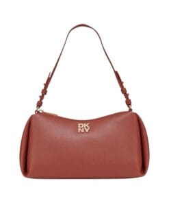 Close-up view of the DKNY Remy Top Zip Shoulder Bag in Brick Red polyurethane, showing the adjustable strap and exterior logo hardware.