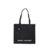 Structured black leather Marc Jacobs Grind tote bag featuring bold logo and silvertone hardware, perfect for professional women in Bahrain.