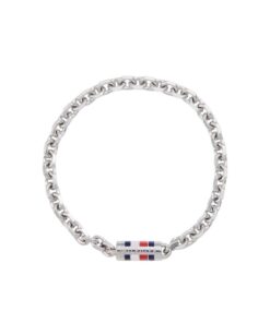Stainless steel chain link bracelet with magnetic closure and signature Tommy Hilfiger enamel stripe, modeled on a man's wrist.
