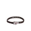 Close-up of Tommy Hilfiger men's brown braided leather bracelet with stainless steel button closure, available in Bahrain.
