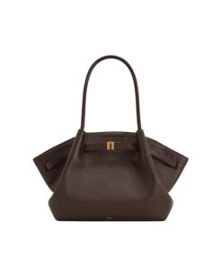Elegant dark brown JW PEI Hana medium tote bag with gold hardware, shown carried over the shoulder by a woman in Bahrain.