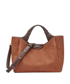 Stylish woman wearing the DKNY Mini Willa Saddle Bag, showcasing its compact design and high-quality leather finish.